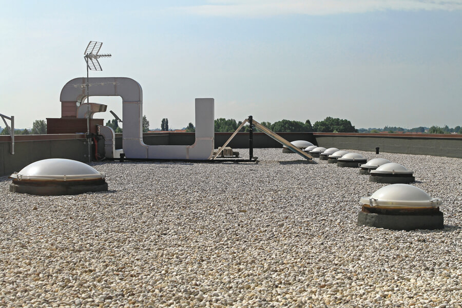 Built-up roofing (BUR) membrane on a commercial roof