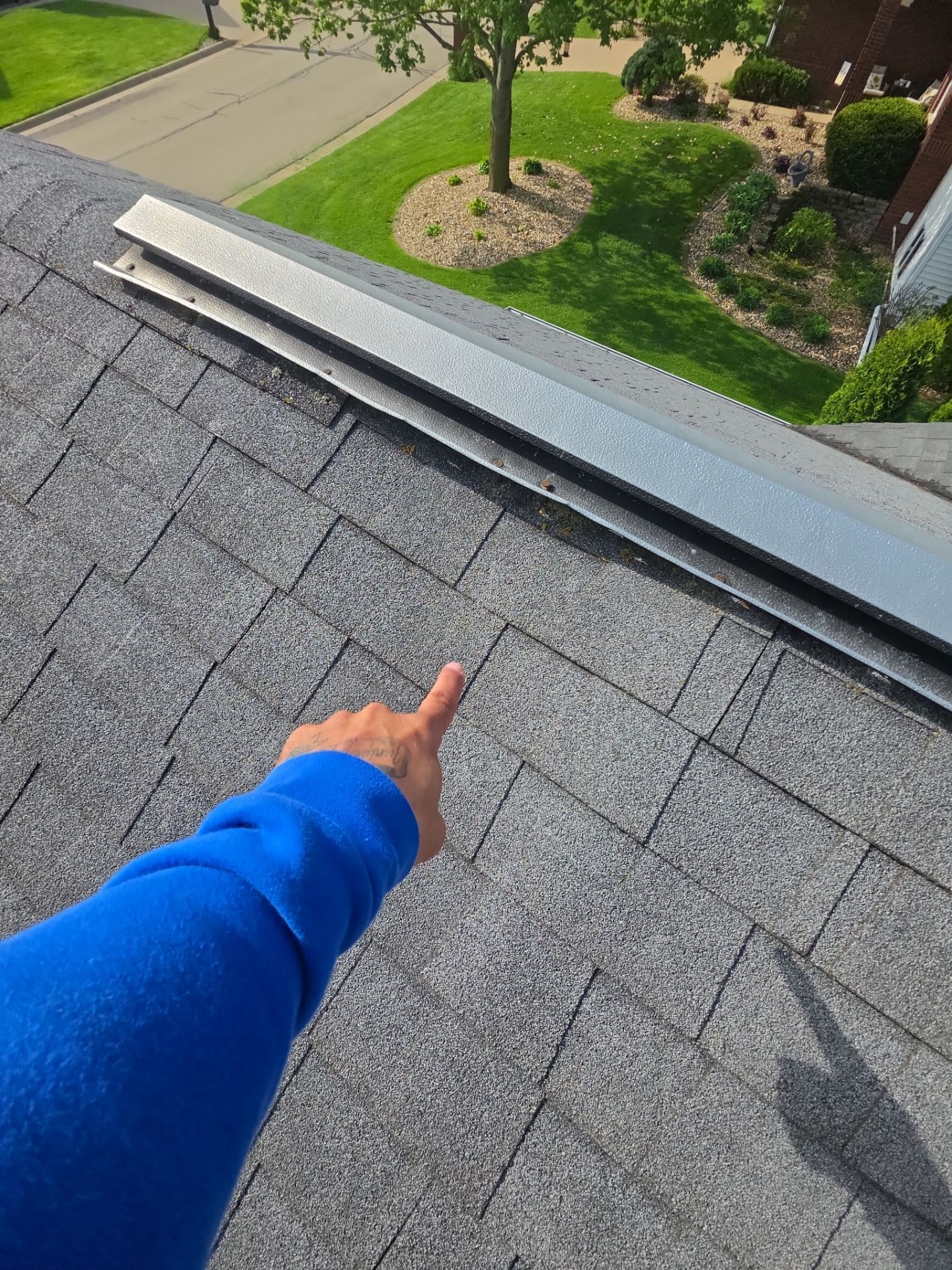 Roof ridge damage discovered during leak inspection in Asbury, IA