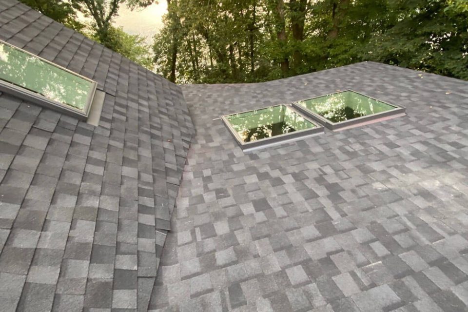 Close up photo of 3 skylights in a newly replaced roof