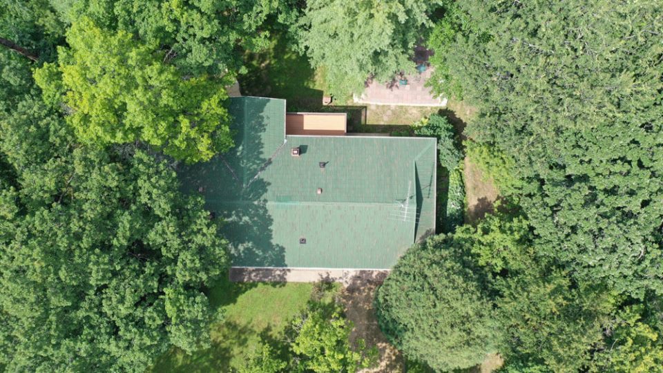 Aerial view of a home before replacing the roof