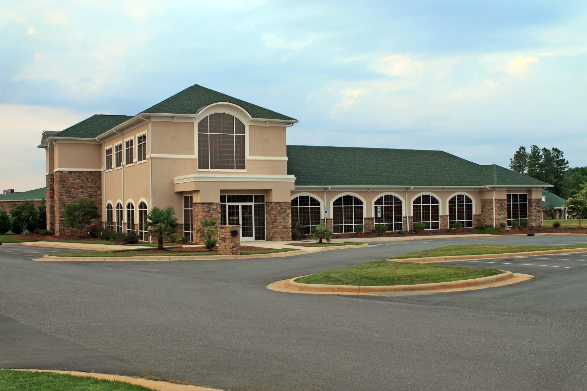 Commercial building with green a green asphalt roof