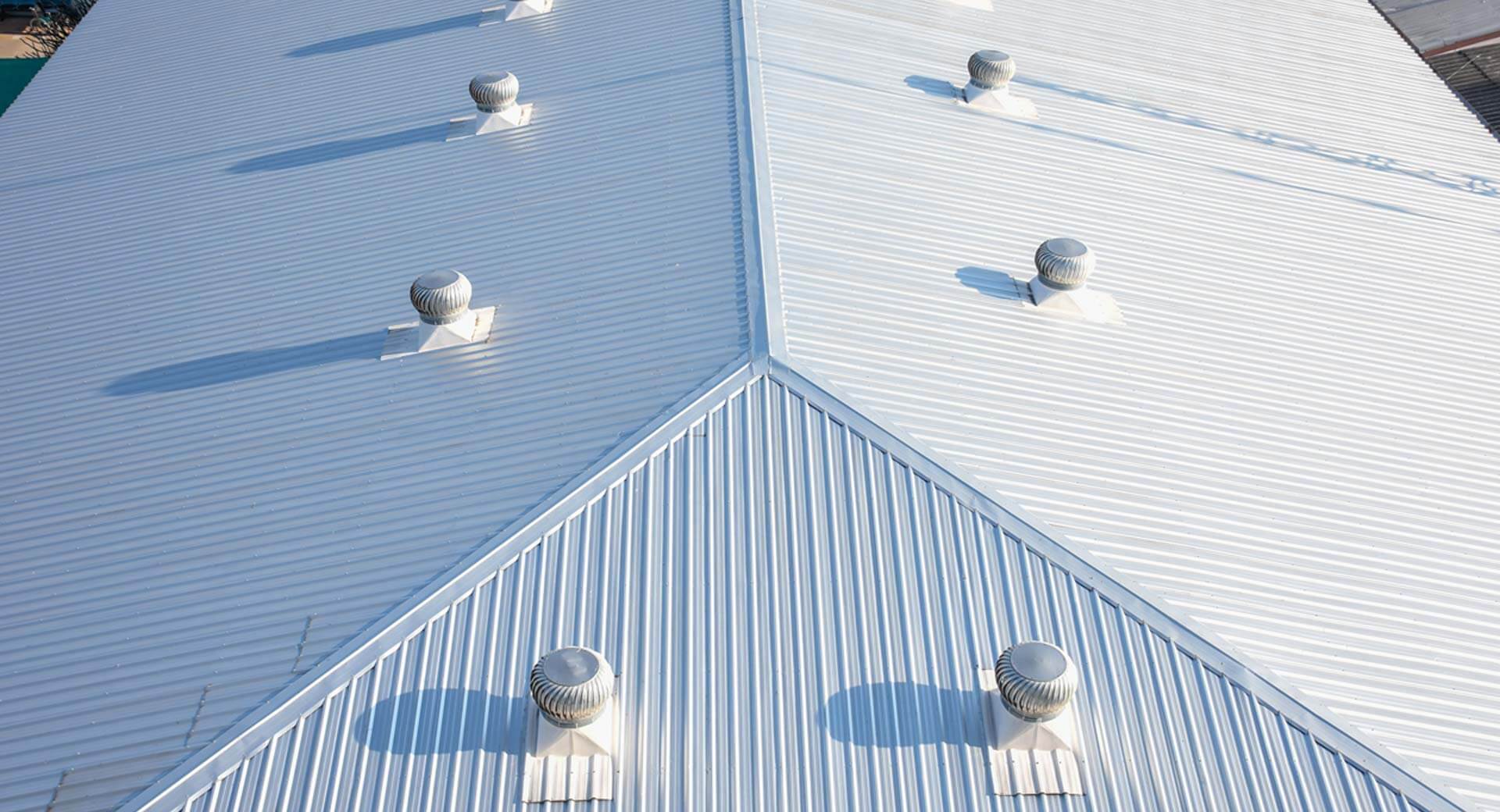 Close up of a commercial white metal roof