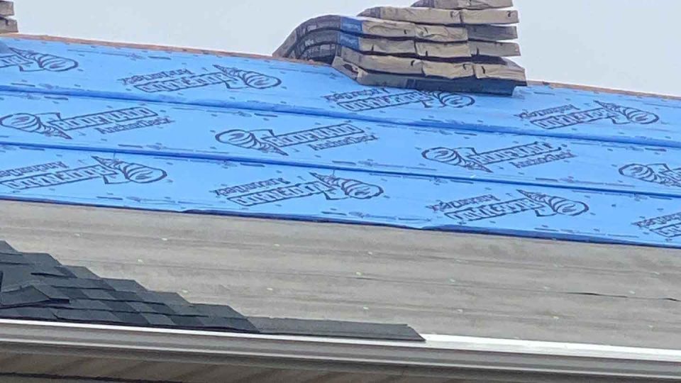 Dubuque, IA house #2 during roof replacement installing roofing underlayment