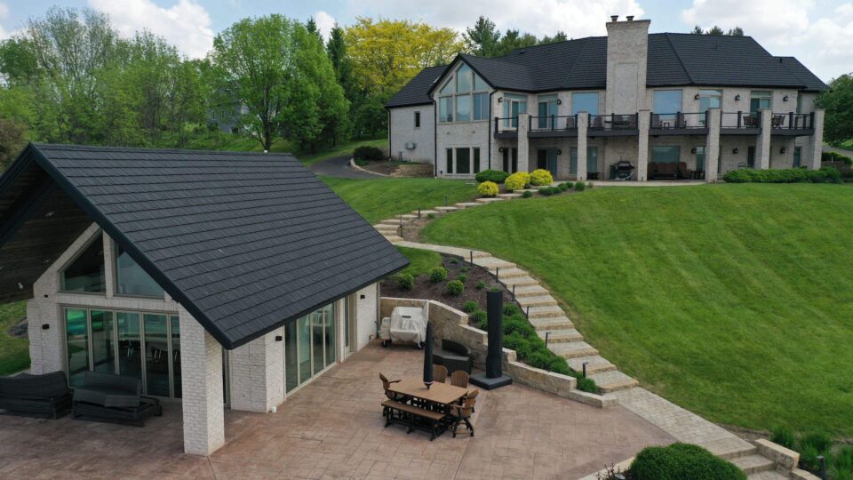 Elevated Roofing metal shake roof replacement on large home