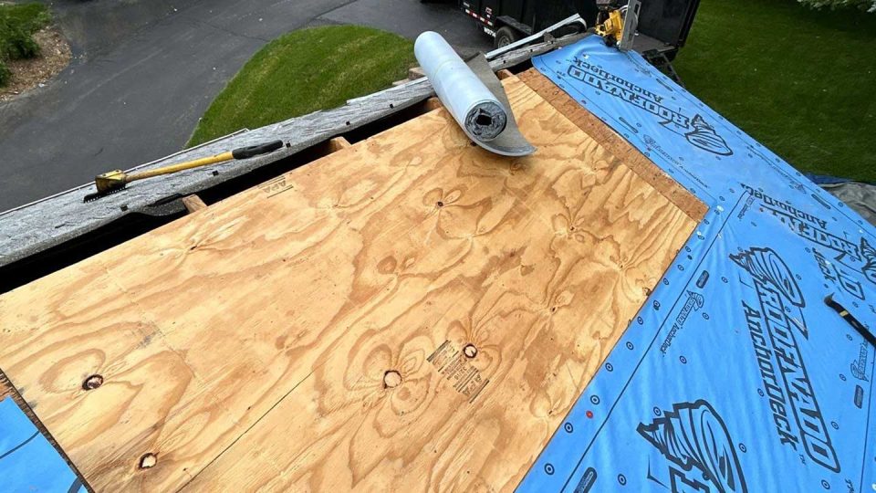 Lanark, IL house #2 during roof replacement as roofers install new plywood and underlayment