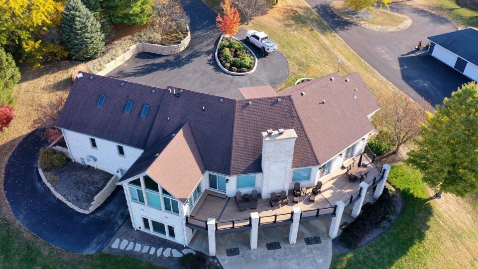 Mount Carroll, IL house #1 before roof replacement showing aging asphalt shingles