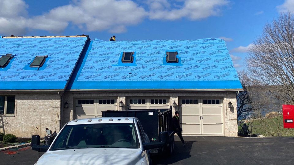 Mount Carroll, IL house #1 during roof replacement installing underlayment