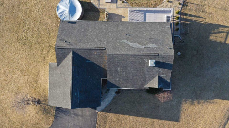 Mount Carroll, IL house #3 before roof replacement showing missing and damaged shingles